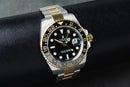 Rolex GMT-Master II 40mm Aço/Dourado Mostrador Preto Luneta Preta