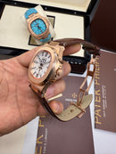 Patek Philippe Nautilus 39mm, Aço/Rose Mostrador Branco, Pulseira Couro
