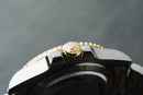 Rolex GMT-Master II 40mm Aço/Dourado Mostrador Preto Luneta Preta