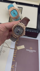 Patek Philippe Nautilus 39mm, Aço/Rose Mostrador Chumbo, Pulseira Couro